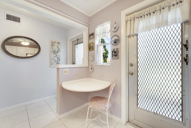 2151 NE 1st Ct Unit 102, Boynton Beach, FL 33435 - tiled dining area with baseboards and crown molding