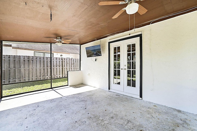view of patio / terrace featuring french doors, a ceiling fan, and fence