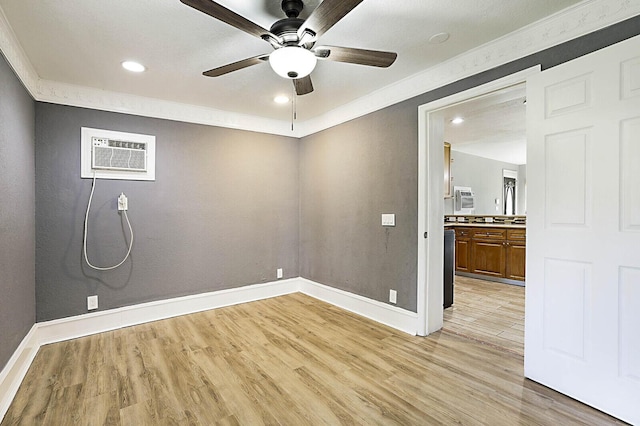 unfurnished room with ceiling fan, light wood finished floors, ornamental molding, baseboards, and recessed lighting