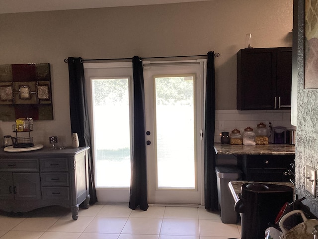 3834 SE 12th Dr, Okeechobee, FL 34974 - doorway to outside with healthy amount of natural light and light tile patterned flooring