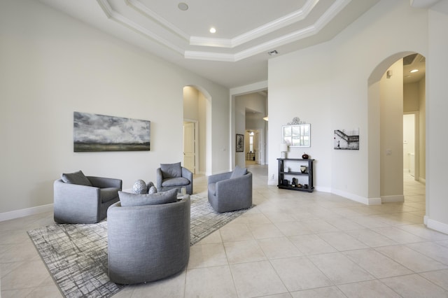212 Montant Dr, Palm Beach Gardens, FL 33410 - living area featuring arched walkways, light tile patterned floors, ornamental molding, a raised ceiling, and recessed lighting