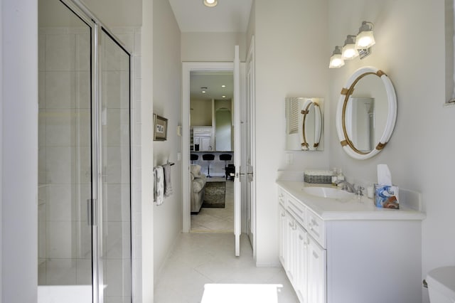 212 Montant Dr, Palm Beach Gardens, FL 33410 - full bathroom with ensuite bathroom, vanity, a shower stall, tile patterned flooring, and baseboards