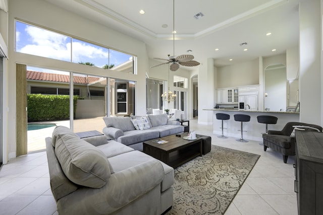 212 Montant Dr, Palm Beach Gardens, FL 33410 - living area with light tile patterned floors, a high ceiling, recessed lighting, ceiling fan, and arched walkways