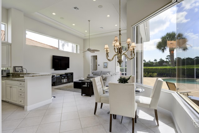 212 Montant Dr, Palm Beach Gardens, FL 33410 - dining room with a high ceiling, light tile patterned flooring, a chandelier, recessed lighting, and ceiling fan