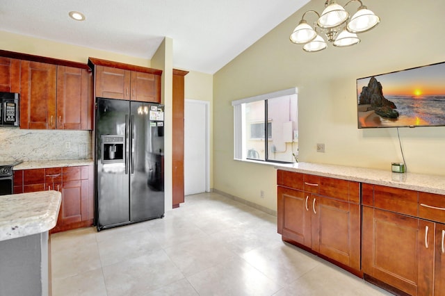 1541 SW 102nd Ter, Davie, FL 33324 - kitchen with black appliances, vaulted ceiling, a chandelier, backsplash, and light stone counters