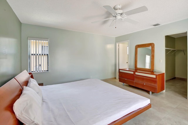 1541 SW 102nd Ter, Davie, FL 33324 - bedroom with a spacious closet, ceiling fan, a closet, and a textured ceiling