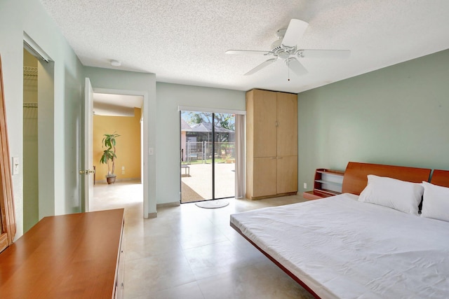 1541 SW 102nd Ter, Davie, FL 33324 - bedroom with access to exterior, a textured ceiling, and a ceiling fan