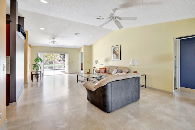 1541 SW 102nd Ter, Davie, FL 33324 - living area with a ceiling fan, a textured ceiling, lofted ceiling, and recessed lighting