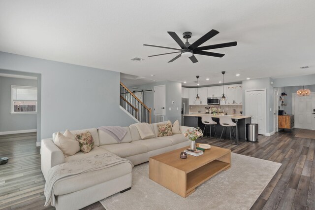 412 SW Dailey Ave, Port Saint Lucie, FL 34953 - living area with ceiling fan, baseboards, dark wood finished floors, and recessed lighting