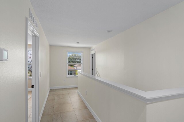 412 SW Dailey Ave, Port Saint Lucie, FL 34953 - hall with baseboards and light tile patterned floors