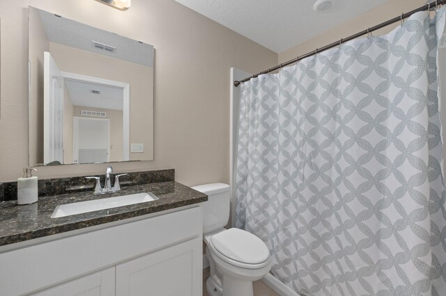 412 SW Dailey Ave, Port Saint Lucie, FL 34953 - full bathroom with toilet, vanity, and a shower with curtain