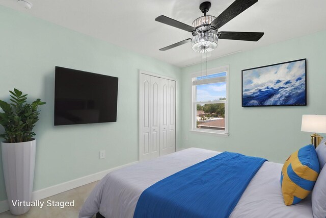 412 SW Dailey Ave, Port Saint Lucie, FL 34953 - bedroom featuring a closet, baseboards, and ceiling fan