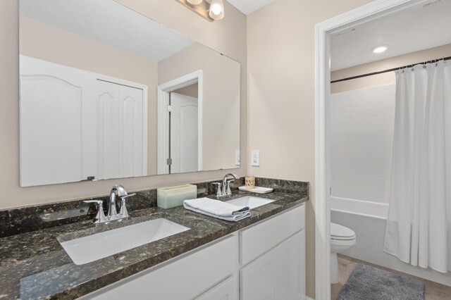 412 SW Dailey Ave, Port Saint Lucie, FL 34953 - full bathroom featuring toilet, double vanity, shower / tub combo, and tile patterned floors