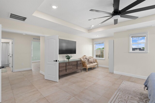412 SW Dailey Ave, Port Saint Lucie, FL 34953 - living area with ceiling fan, recessed lighting, a raised ceiling, baseboards, and light tile patterned floors