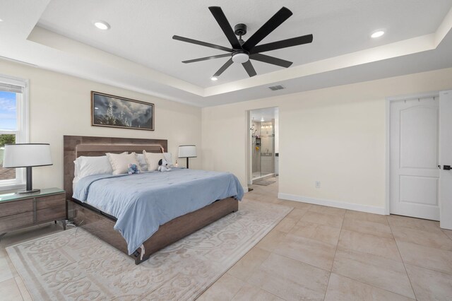 412 SW Dailey Ave, Port Saint Lucie, FL 34953 - bedroom featuring a raised ceiling, baseboards, recessed lighting, ensuite bathroom, and a ceiling fan