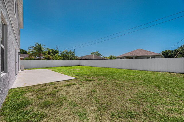 412 SW Dailey Ave, Port Saint Lucie, FL 34953 - view of yard featuring a patio