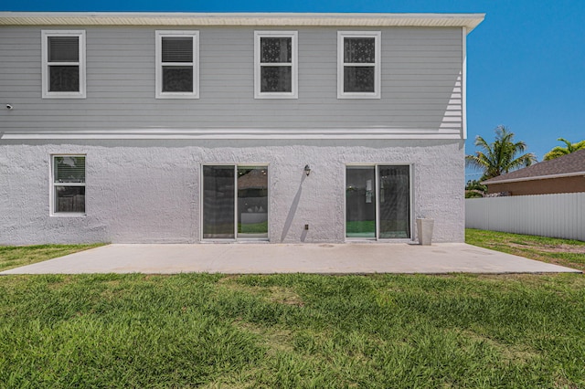 412 SW Dailey Ave, Port Saint Lucie, FL 34953 - rear view of property featuring stucco siding and a patio area