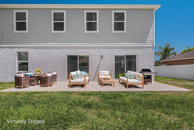 412 SW Dailey Ave, Port Saint Lucie, FL 34953 - back of property featuring an outdoor living space, stucco siding, and a patio area