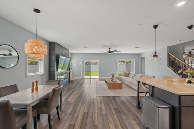 412 SW Dailey Ave, Port Saint Lucie, FL 34953 - dining space featuring a ceiling fan, stairs, dark wood-style flooring, and baseboards