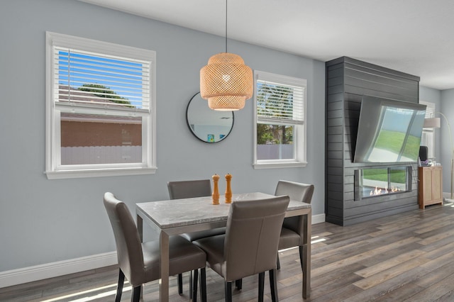 412 SW Dailey Ave, Port Saint Lucie, FL 34953 - dining room featuring baseboards and wood finished floors
