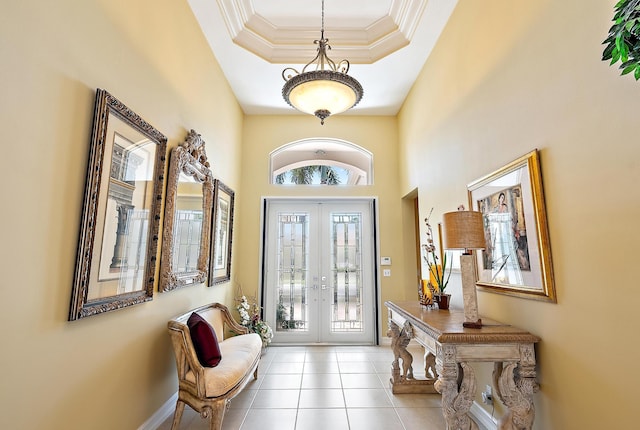 7731 Blue Heron Way, West Palm Beach, FL 33412 - foyer entrance with a tray ceiling, french doors, tile patterned floors, ornamental molding, and baseboards