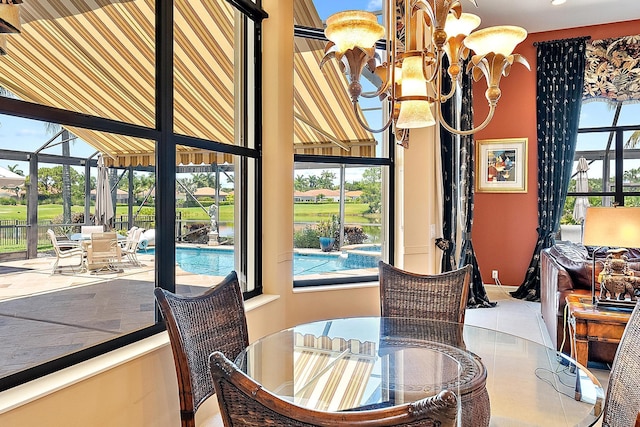 7731 Blue Heron Way, West Palm Beach, FL 33412 - dining room with a chandelier, healthy amount of natural light, tile patterned flooring, and recessed lighting