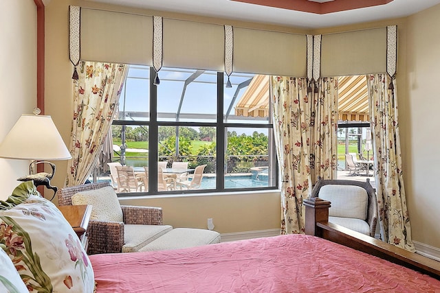 7731 Blue Heron Way, West Palm Beach, FL 33412 - bedroom with multiple windows and baseboards