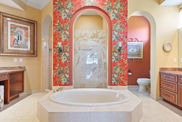 7731 Blue Heron Way, West Palm Beach, FL 33412 - bathroom featuring vanity, a garden tub, toilet, crown molding, and tile patterned flooring