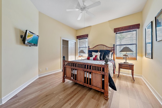 7731 Blue Heron Way, West Palm Beach, FL 33412 - bedroom with light wood finished floors, baseboards, and ceiling fan