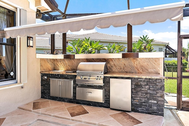 7731 Blue Heron Way, West Palm Beach, FL 33412 - view of patio featuring exterior kitchen, grilling area, and fence