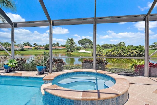 7731 Blue Heron Way, West Palm Beach, FL 33412 - view of pool with a water view, glass enclosure, and a pool with connected hot tub