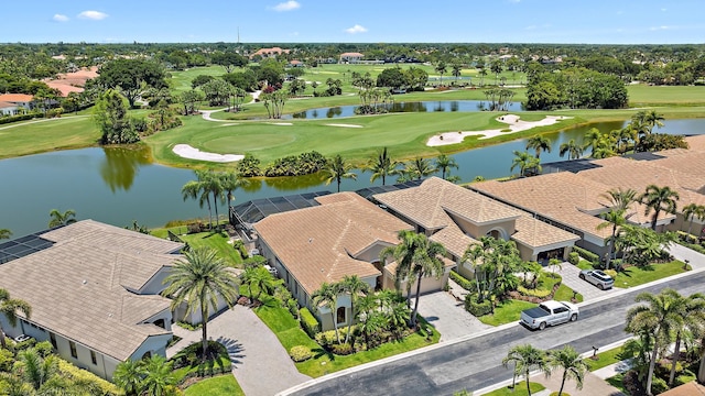 7731 Blue Heron Way, West Palm Beach, FL 33412 - aerial view of residential area with a nearby body of water, a golf course, and a tree filled landscape