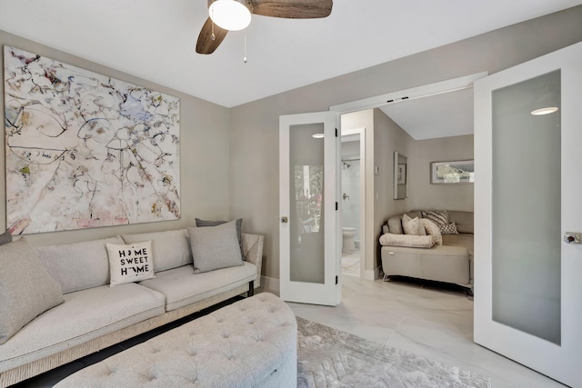 living area with light marble finish flooring and ceiling fan