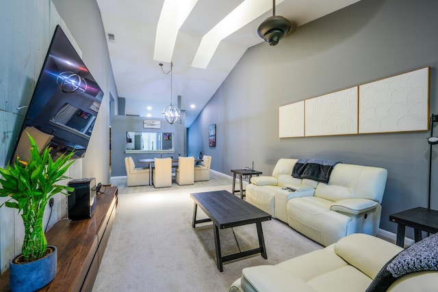 living area with a chandelier, lofted ceiling, and baseboards
