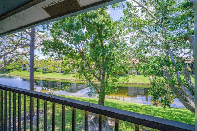 water view featuring a tree filled landscape