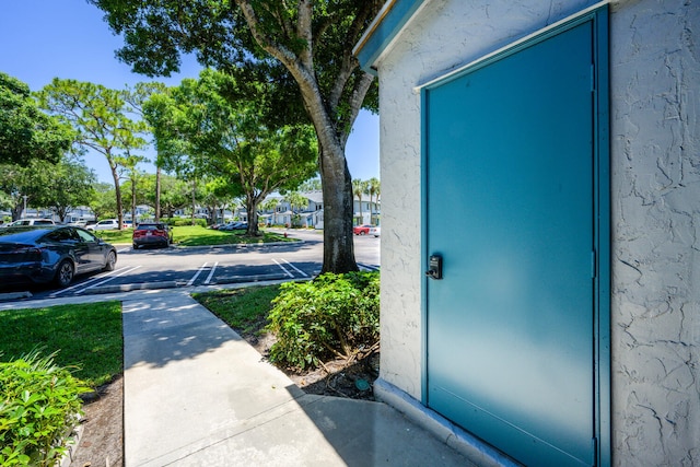 exterior view of a parking lot and stucco siding
