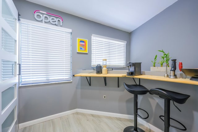 office area featuring baseboards and healthy amount of natural light