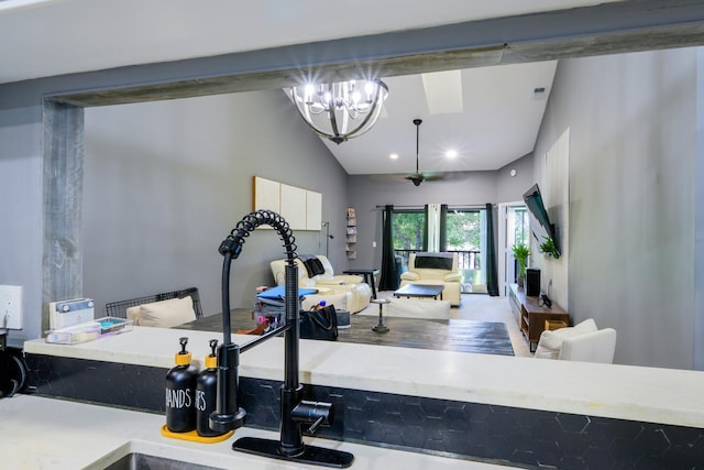 exercise room featuring vaulted ceiling, a chandelier, and recessed lighting