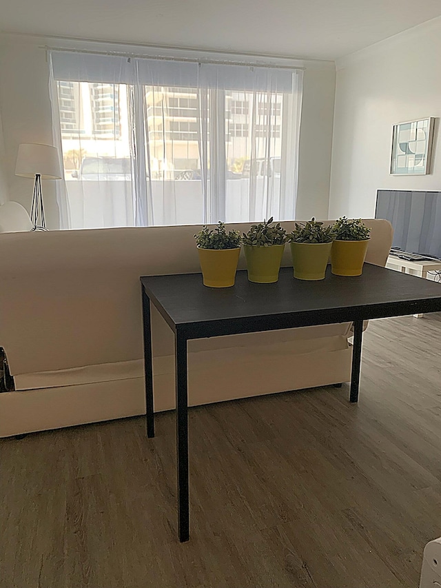 3001 S Ocean Dr S Unit 101, Hollywood, FL 33019 - dining room featuring wood finished floors and healthy amount of natural light