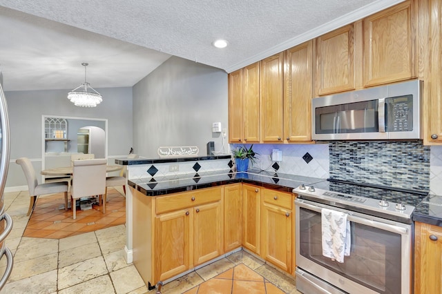 16888 W Downers Dr W, The Acreage, FL 33470 - kitchen featuring stainless steel appliances, decorative backsplash, a peninsula, a textured ceiling, and a chandelier