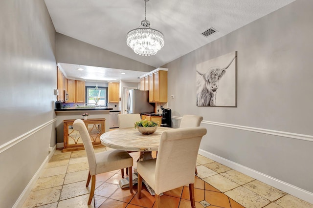 16888 W Downers Dr W, The Acreage, FL 33470 - dining room featuring a chandelier, lofted ceiling, and baseboards