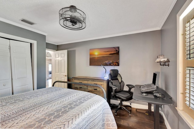 16888 W Downers Dr W, The Acreage, FL 33470 - bedroom featuring wood finished floors, baseboards, ornamental molding, a textured ceiling, and a desk