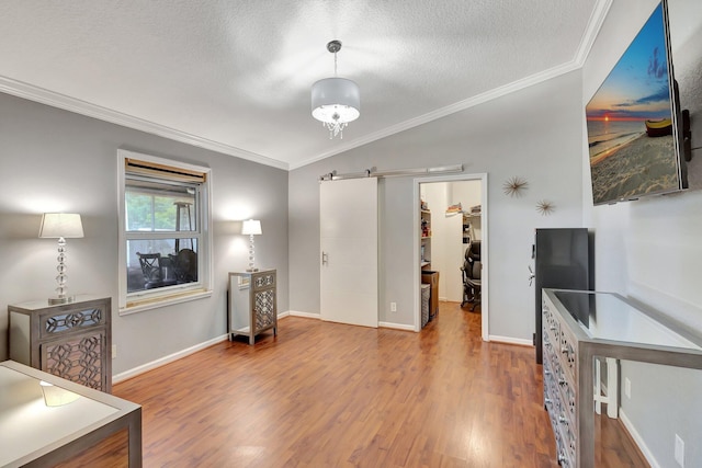 16888 W Downers Dr W, The Acreage, FL 33470 - living room featuring ornamental molding, wood finished floors, a textured ceiling, and baseboards
