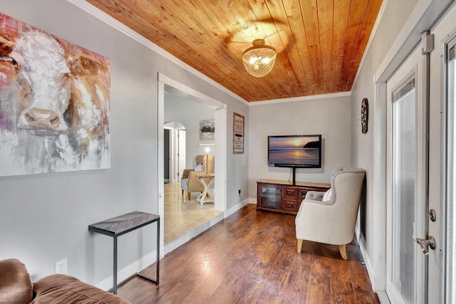 16888 W Downers Dr W, The Acreage, FL 33470 - living area with ornamental molding, wood ceiling, arched walkways, wood finished floors, and baseboards