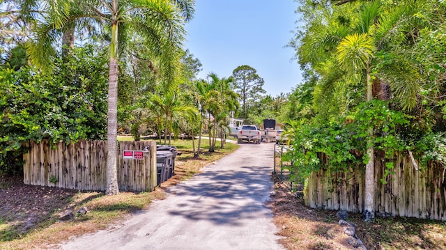 16888 W Downers Dr W, The Acreage, FL 33470 - view of asphalt driveway featuring a gate and a gated entry