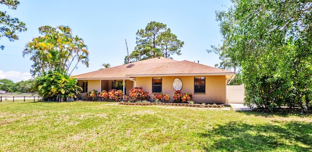 16888 W Downers Dr W, The Acreage, FL 33470 - view of front facade with stucco siding