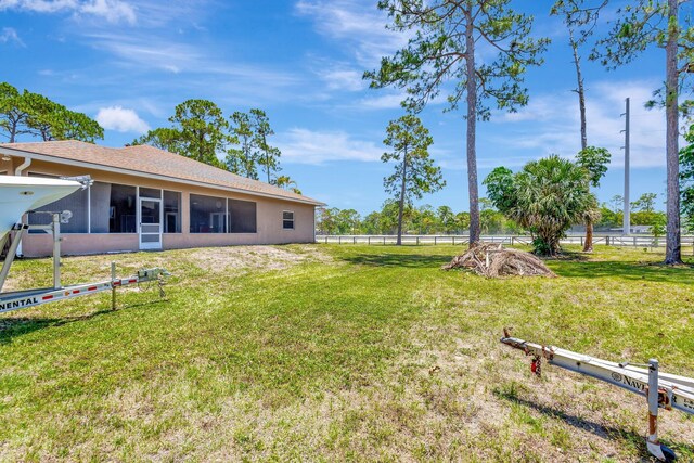 16888 W Downers Dr W, The Acreage, FL 33470 - view of yard featuring a sunroom