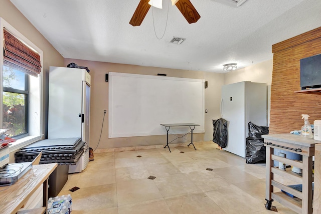 16888 W Downers Dr W, The Acreage, FL 33470 - office area with a ceiling fan and a textured ceiling