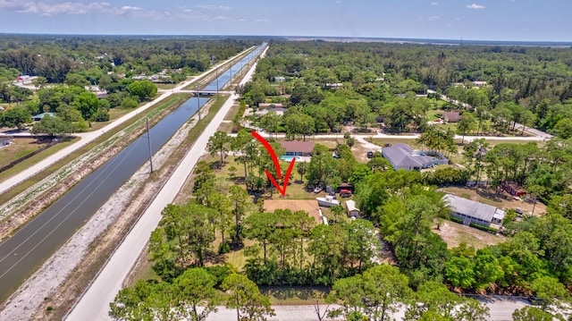 16888 W Downers Dr W, The Acreage, FL 33470 - aerial view of property's location featuring a heavily wooded area and a large body of water