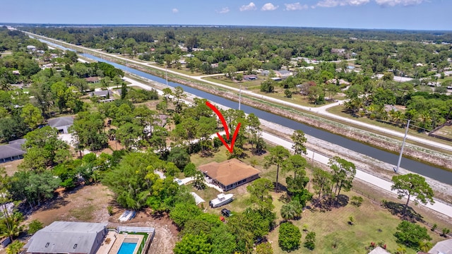 16888 W Downers Dr W, The Acreage, FL 33470 - aerial perspective of suburban area with a nearby body of water